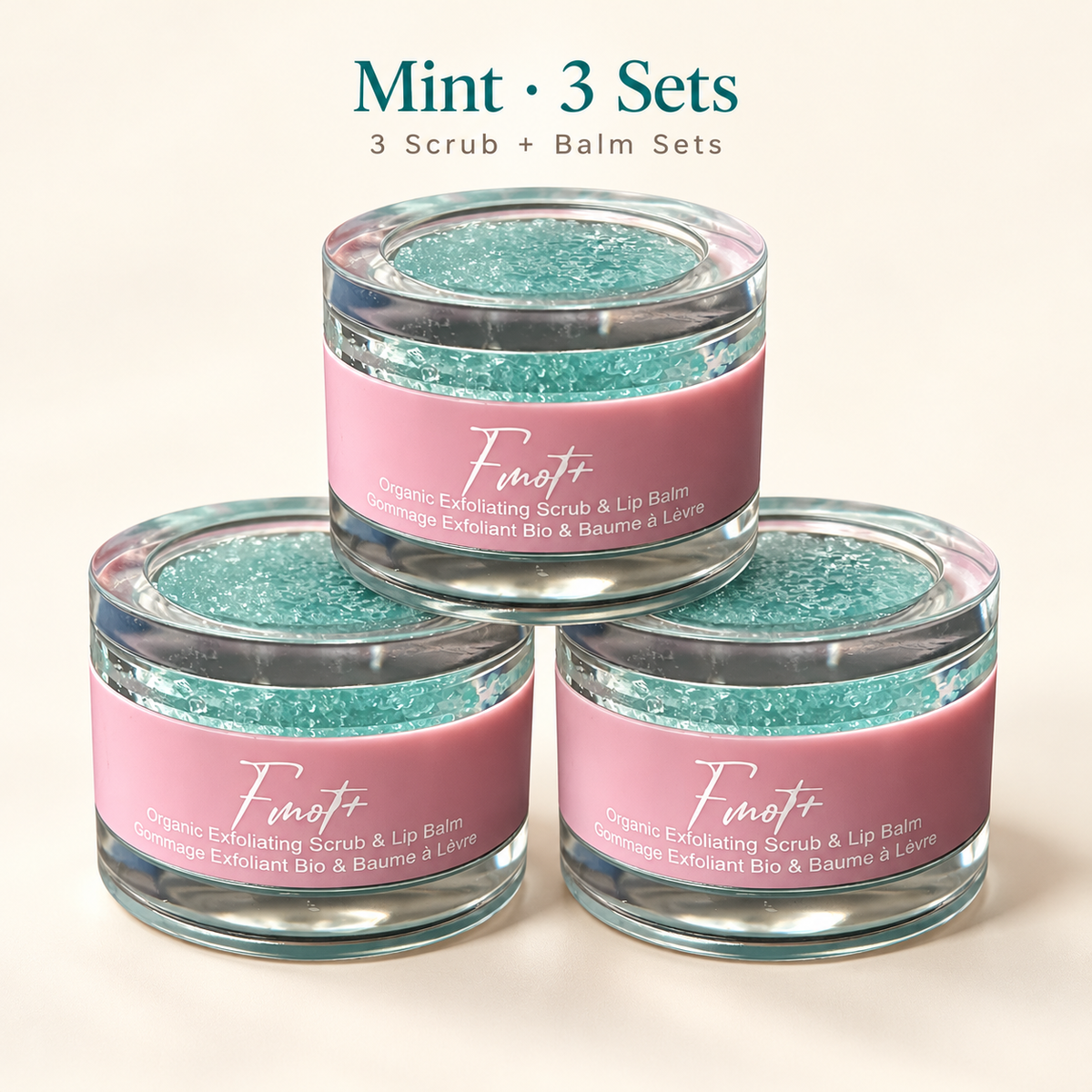 mint three lip scrub and balm set, with clear round packaging and pink label.