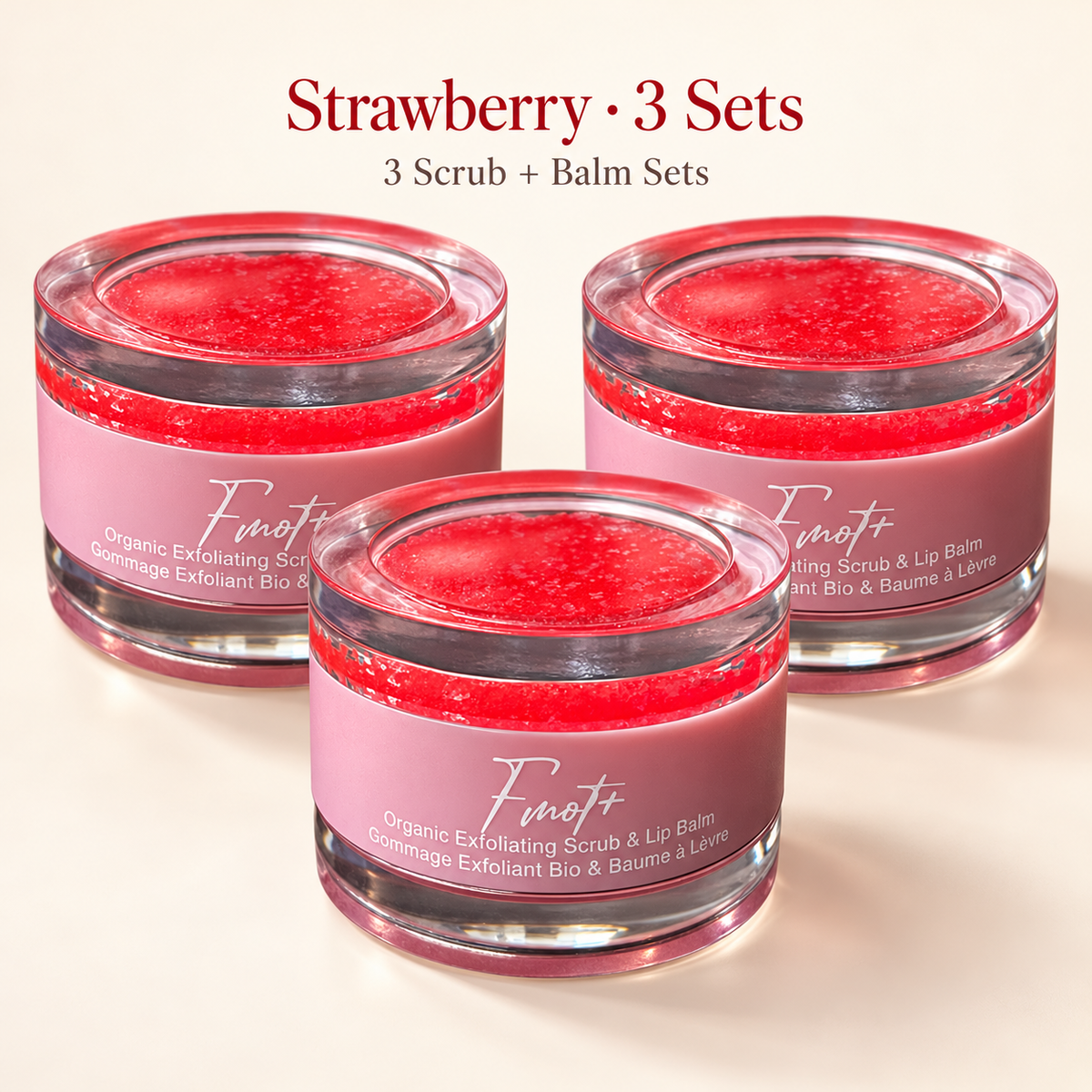 strawberry three lip scrub and balm set, with clear round packaging and pink label.