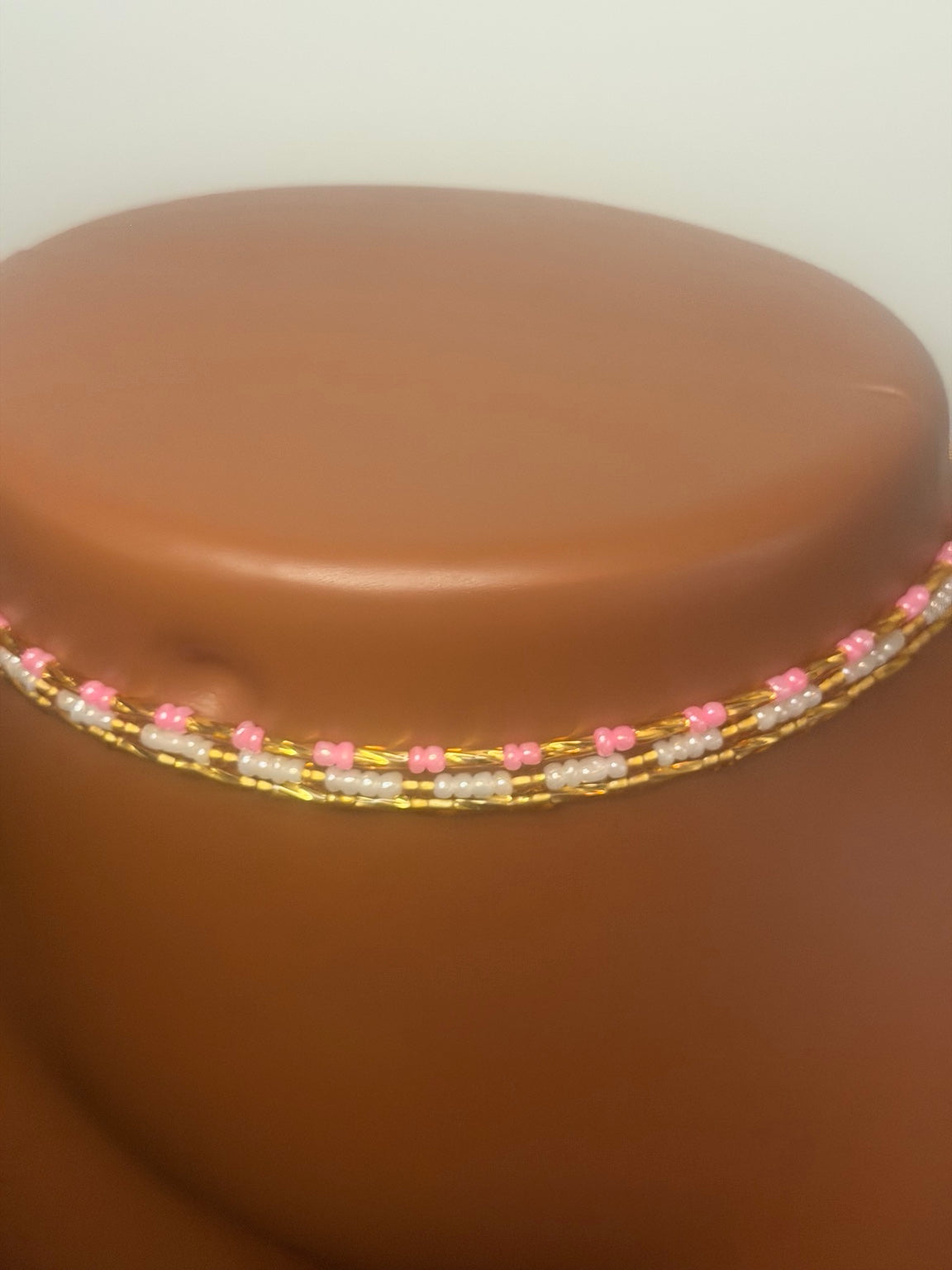 Blush Luxe: 3 separate tie-on waist bead strands; Pink & Gold, Pearl & Gold, Classic Gold. Actual product photo on display mannequin.