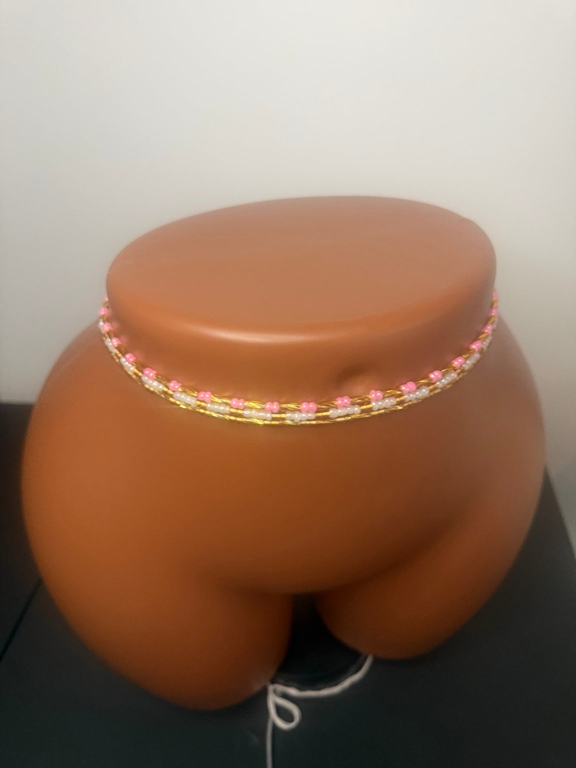 Blush Luxe: 3 separate tie-on waist bead strands; Pink & Gold, Pearl & Gold, Classic Gold. Actual product photo on display mannequin.