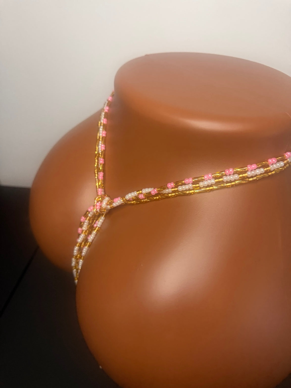 Blush Luxe: 3 separate tie-on waist bead strands; Pink & Gold, Pearl & Gold, Classic Gold. Actual product photo on display mannequin.