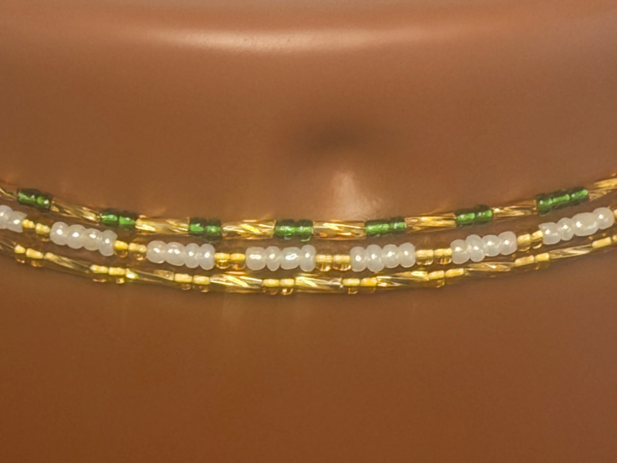 Emerald Luxe: 3 separate tie-on waist bead strands; Emerald Green & Gold, Pearl & Gold, Classic Gold. Actual product photo on display mannequin.