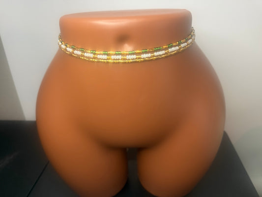 Emerald Luxe: 3 separate tie-on waist bead strands; Emerald Green & Gold, Pearl & Gold, Classic Gold. Actual product photo on display mannequin.