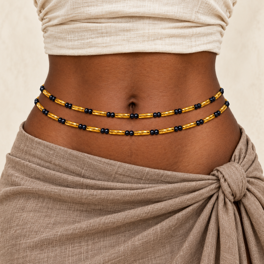 Navy Blue & Gold waist beads on adult model with natural linen styling. Two strands shown; one strand per purchase.